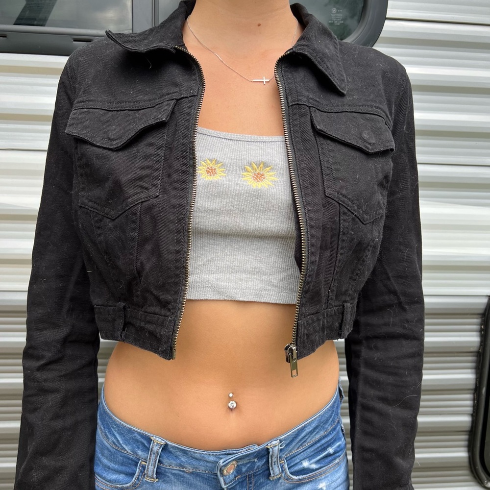 Black denim crop jean jacket with zipper and two pockets on the front
